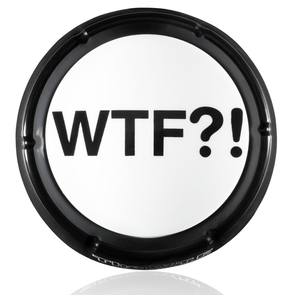 Top view of black and white WTF Button with large bold WTF?! text and black rim