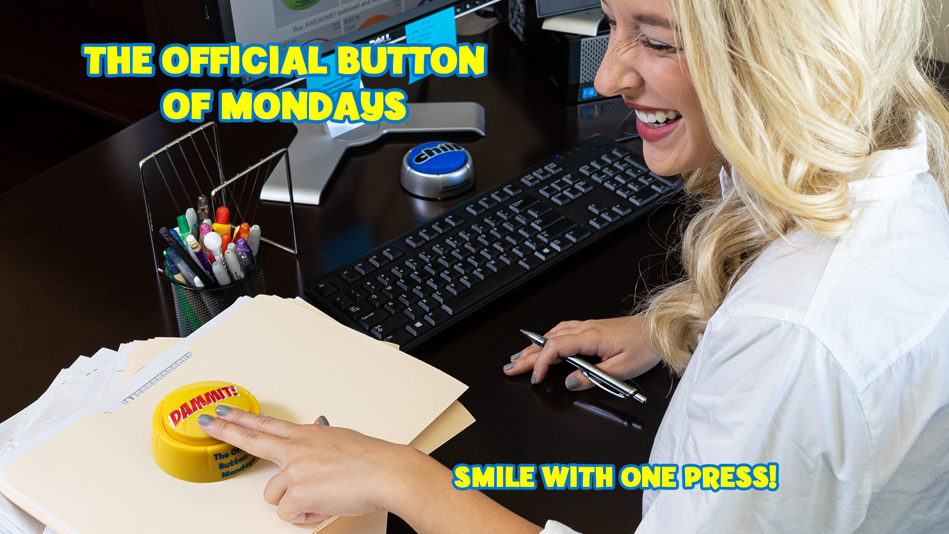 Woman pressing Dammit Button at work and laughing